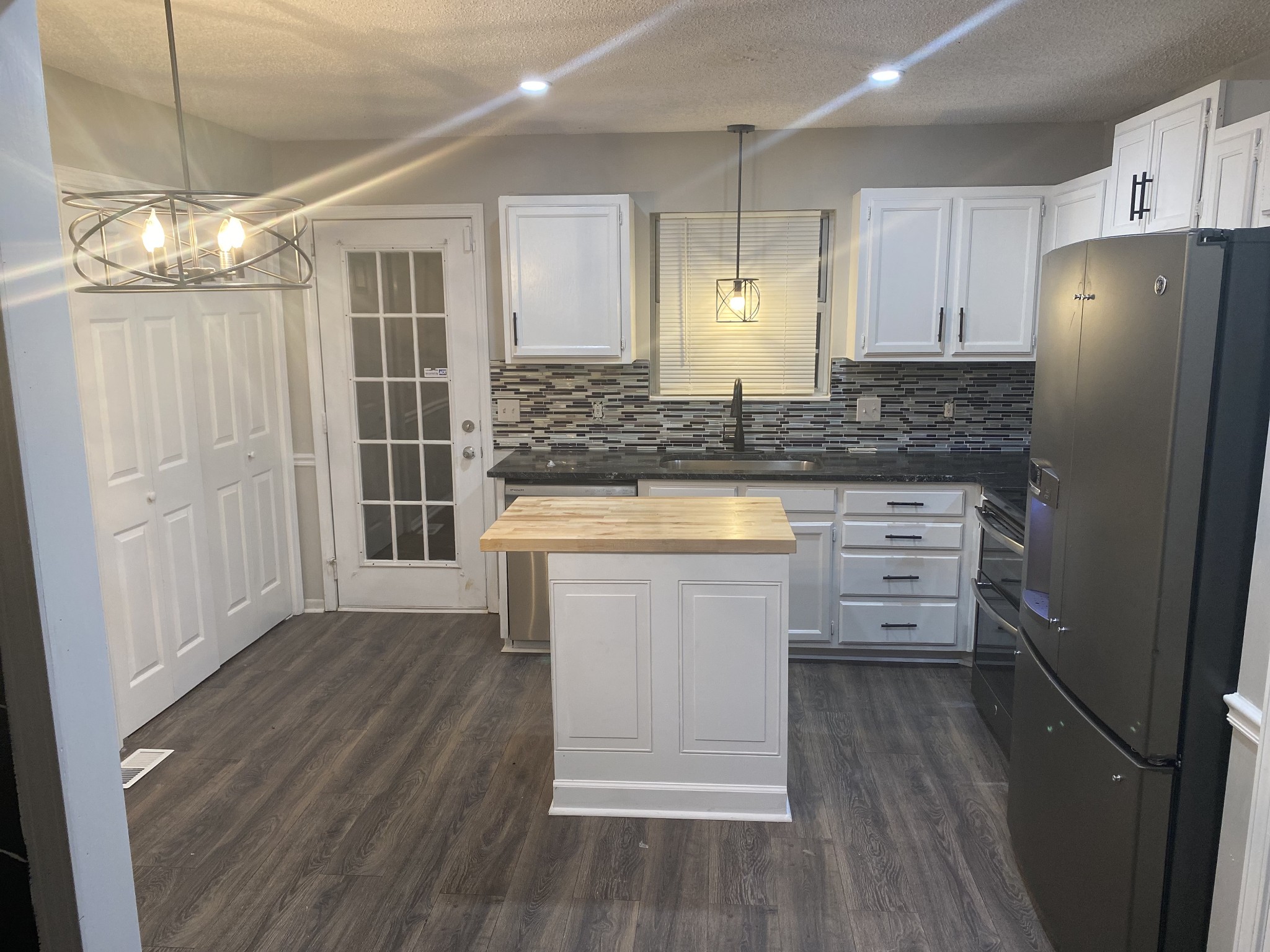3508 Country Way Road Antioch, TN 37013 - Photo 5 of 11 a kitchen with granite countertop a refrigerator a sink and white cabinets