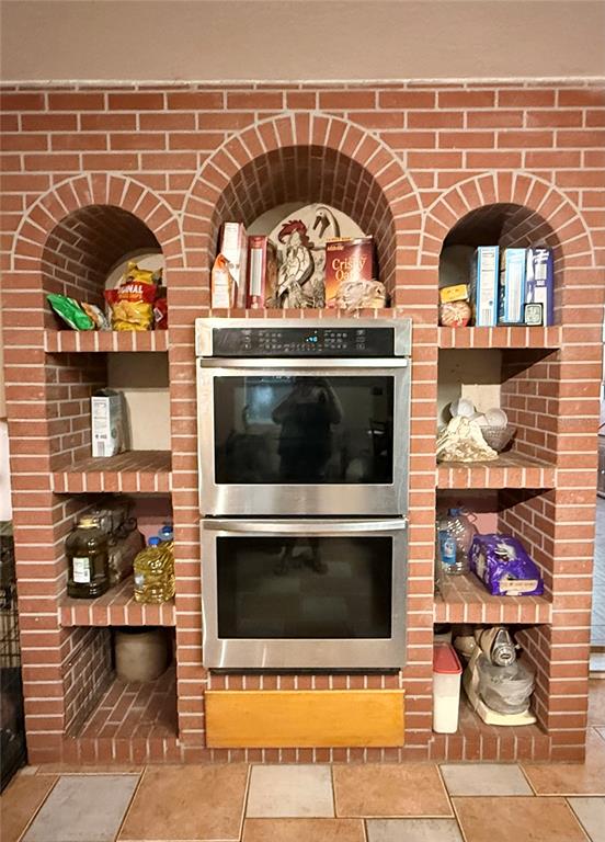1121 Old Polk City Road Lakeland, FL 33809 - Photo 11 of 46 a living room with a fireplace and a flat screen tv