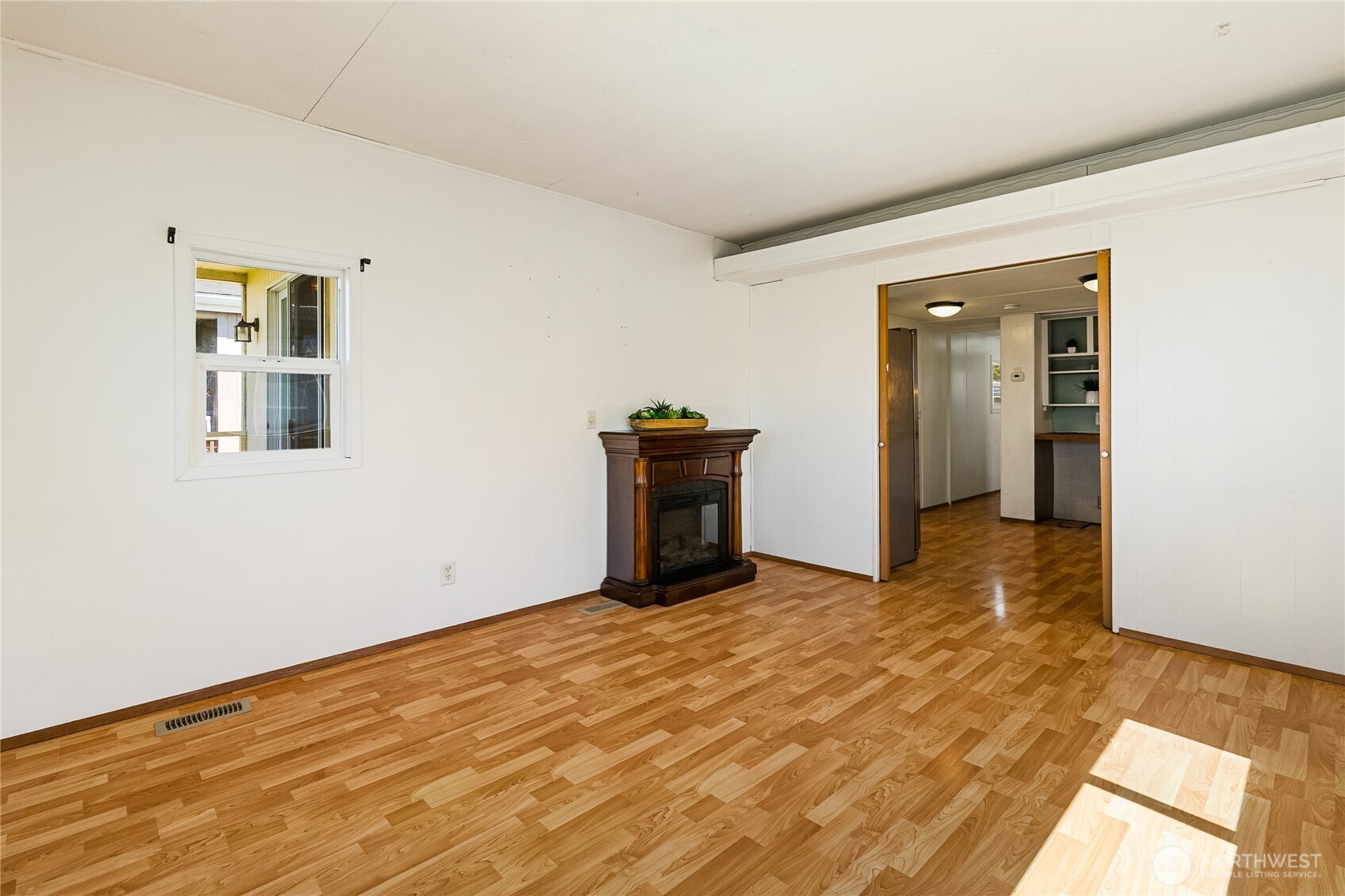 8080 Harborview Road, Unit 167 Blaine, WA 98230 - Photo 12 of 27 a view of a livingroom with wooden floor and a window