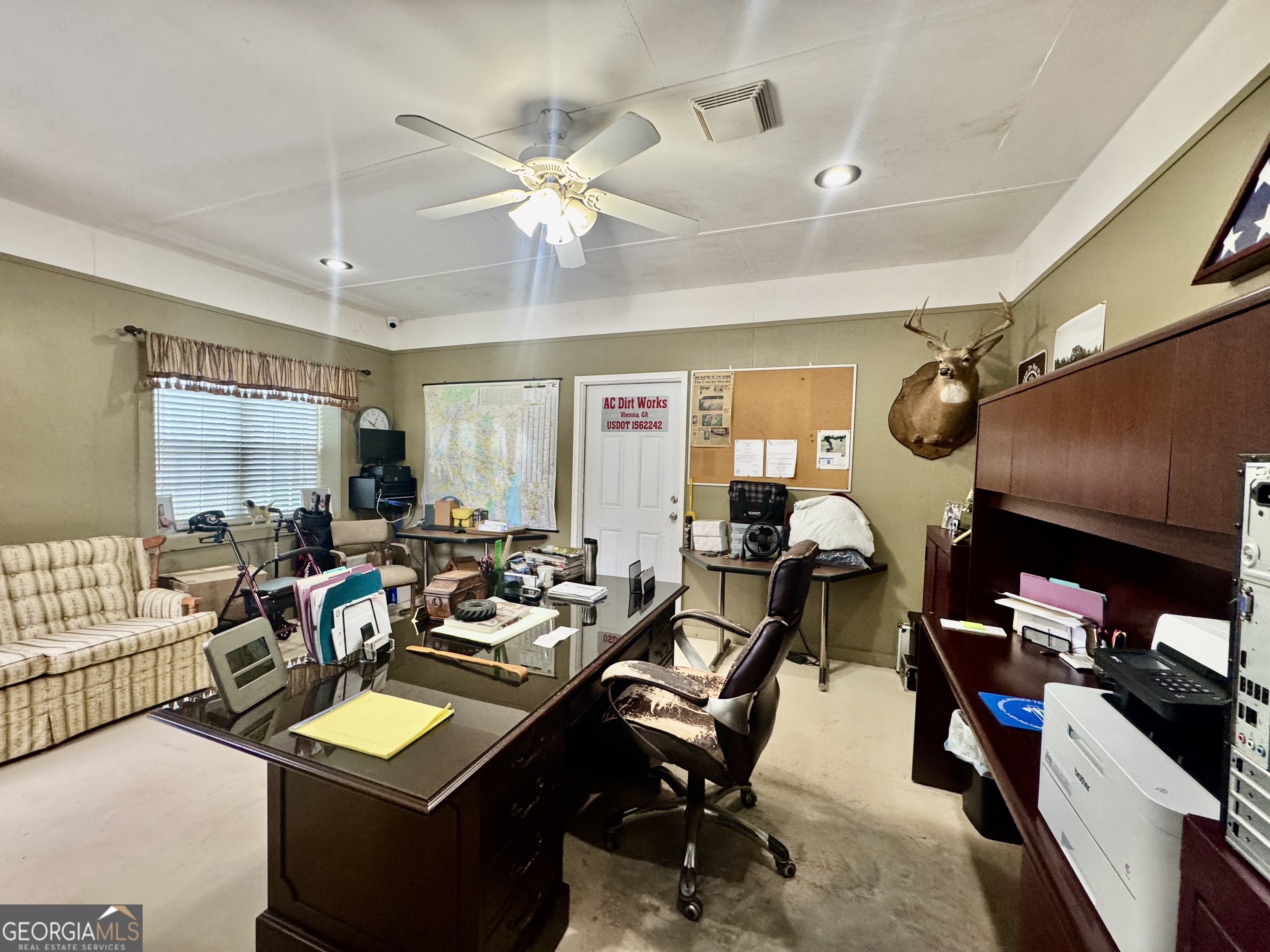 345 Cool Water Road Vienna, GA 31092 - Photo 16 of 41 a living room with furniture a air conditioner vent and a window