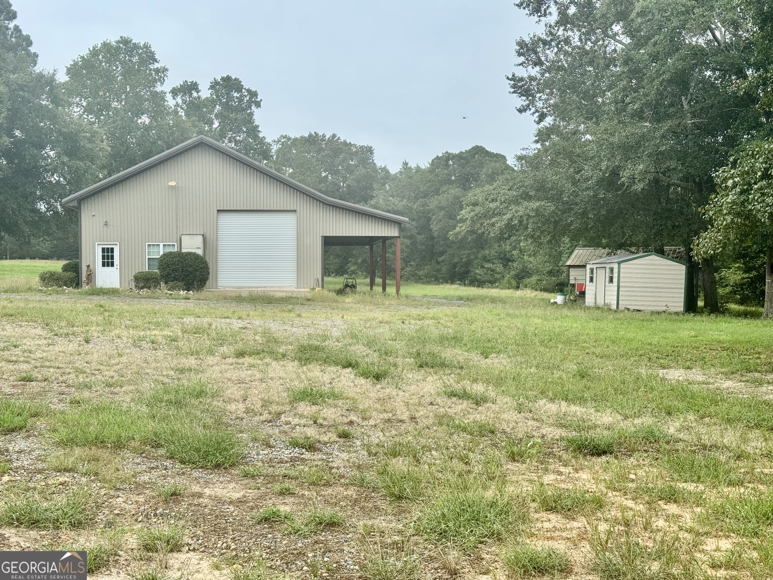 345 Cool Water Road Vienna, GA 31092 - Photo 21 of 41 a house with green field in front of it