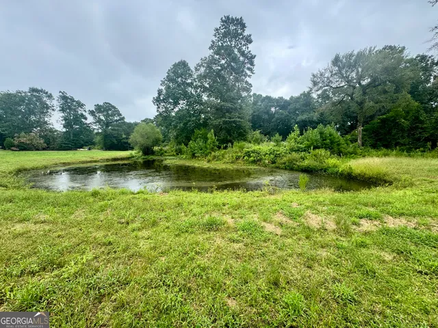 a view of outdoor space with deck and yard