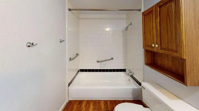 a bathroom with a shower and a tub