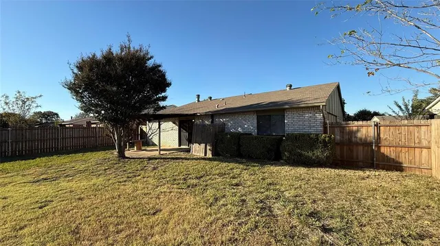 a front view of house with yard covered with green space