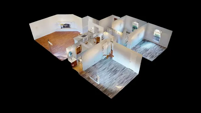 a view of living room with furniture and wooden floor