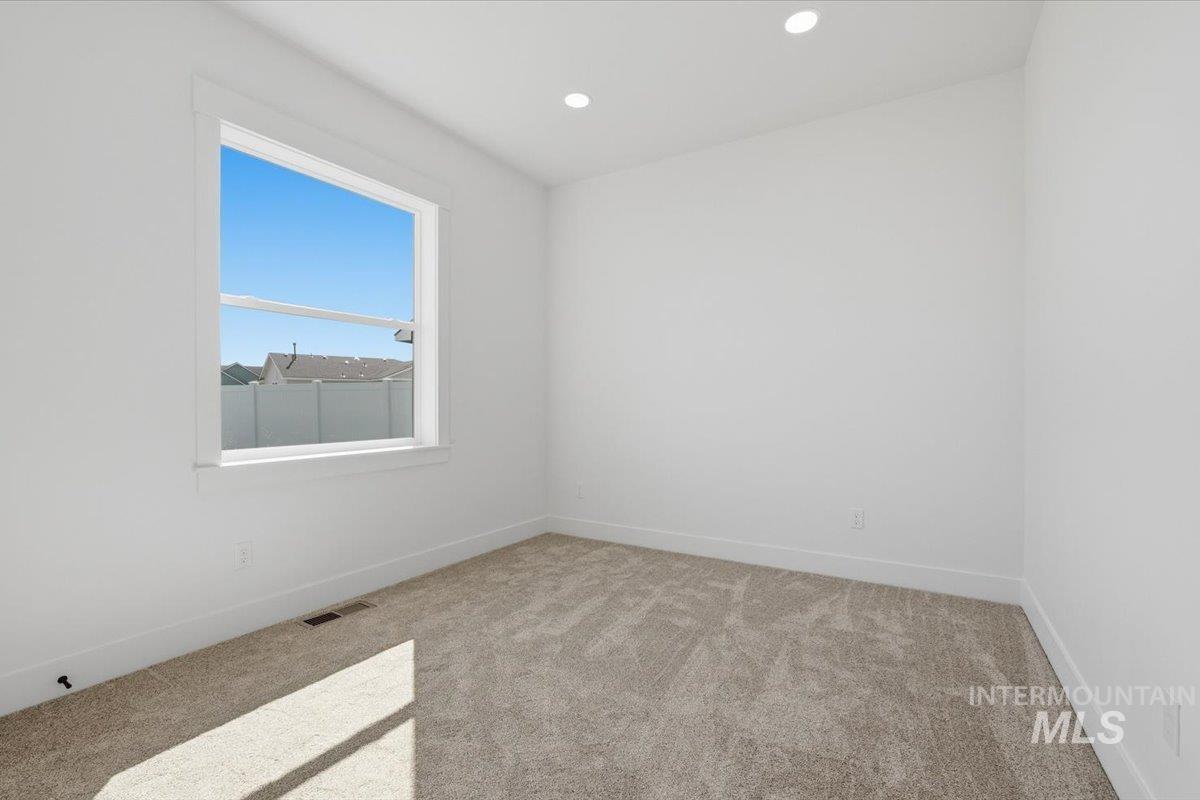 2175 Austin Way Fruitland, ID 83619 - Photo 15 of 30 Empty room featuring light colored carpet and recessed lighting