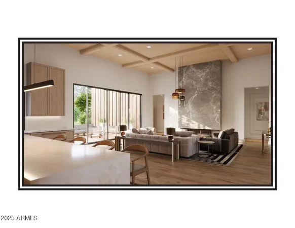 a living room with couches and painting on the wall