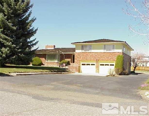 1155 Sweetwater Drive Reno, NV 89509 - Photo 1 of 1 a view of a house with a swimming pool and a yard