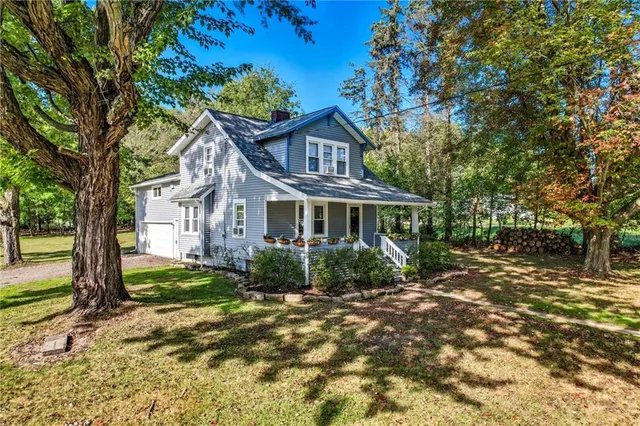 a front view of a house with garden