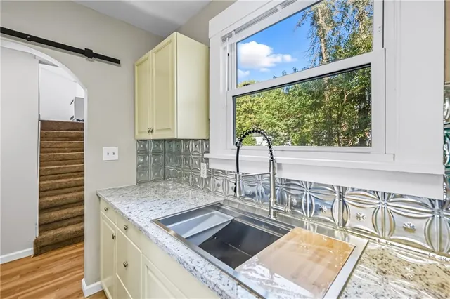a kitchen with a sink and window