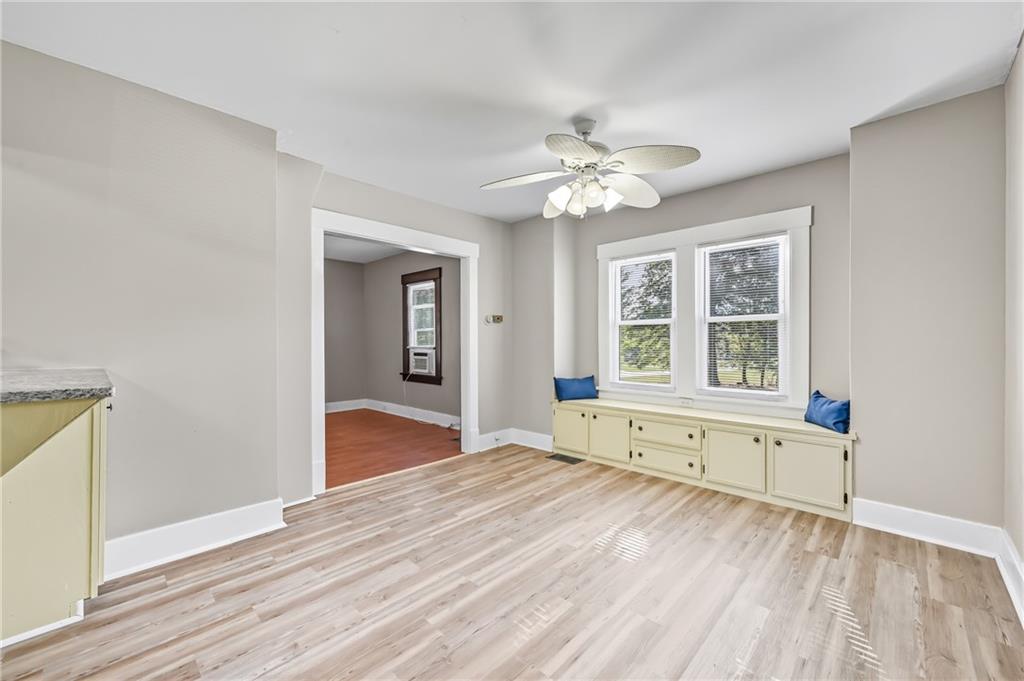 1039 North Keel Ridge Road Hermitage, PA 16148 - Photo 17 of 47 a view of an empty room with a window and wooden floor