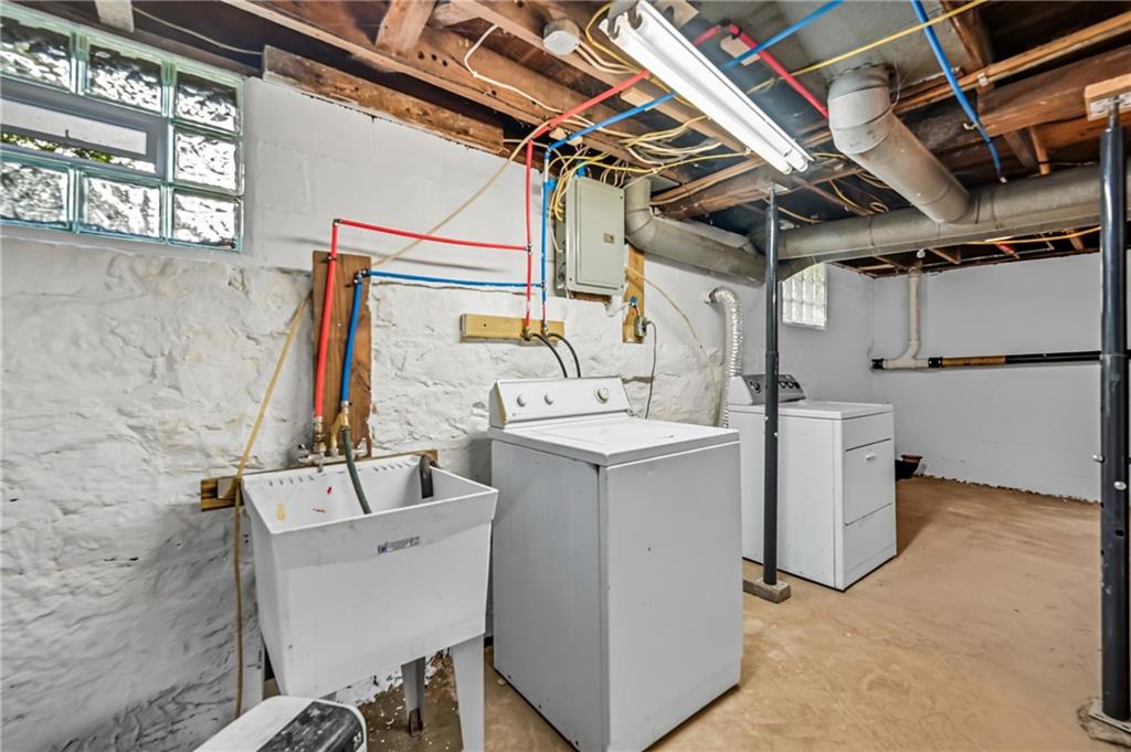 1039 North Keel Ridge Road Hermitage, PA 16148 - Photo 21 of 47 a utility room with a sink a washer and dryer