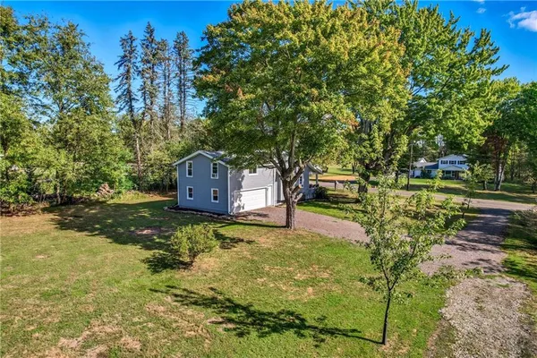 a view of a house with a yard