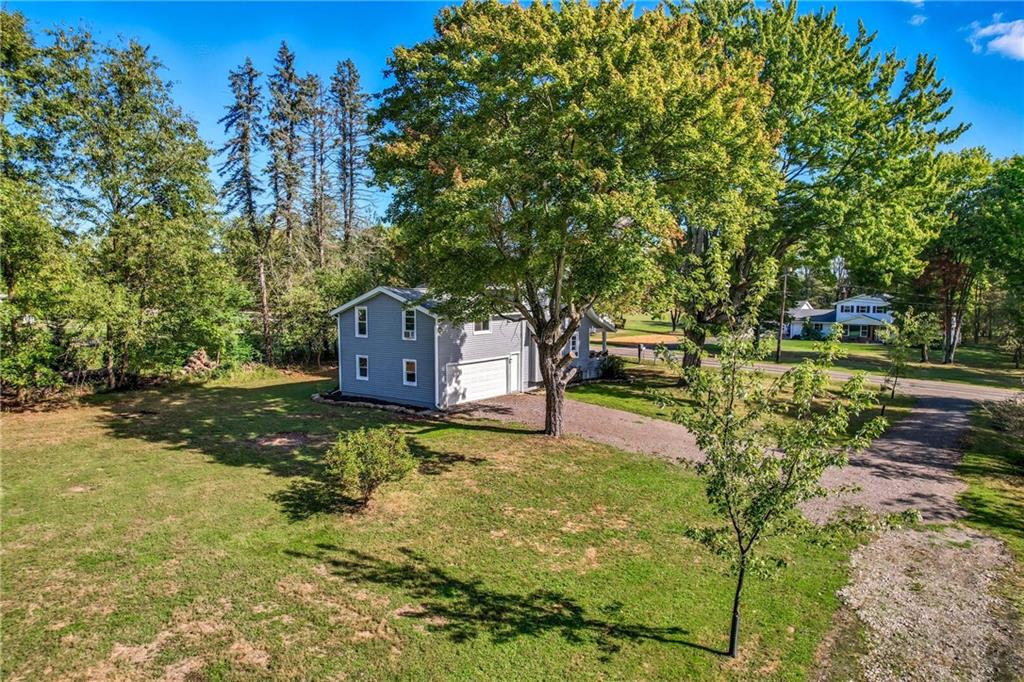 1039 North Keel Ridge Road Hermitage, PA 16148 - Photo 41 of 47 a backyard of a house with a yard and outdoor seating