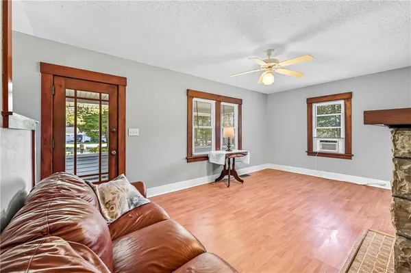a kitchen with granite countertop sink stove and cabinets