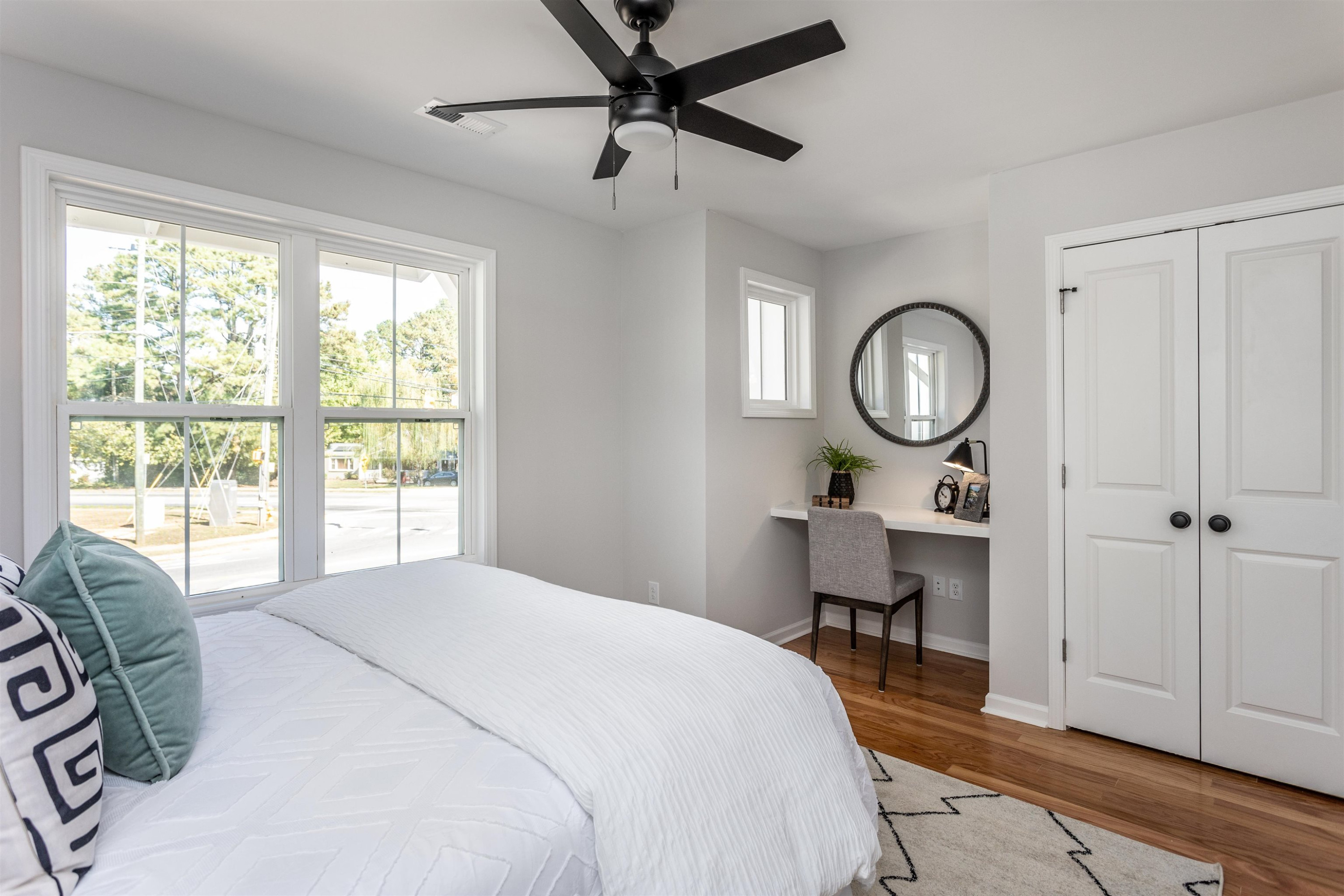622 Rush Street Raleigh, NC 27610 - Photo 18 of 26 a bedroom with a bed mirror and a window