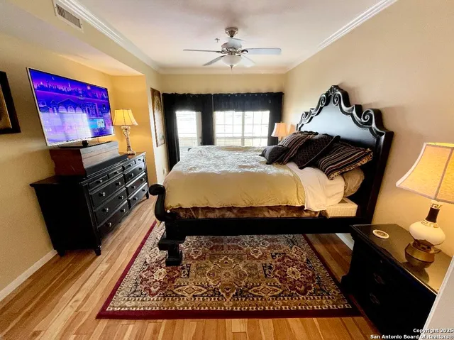 a bed room with a bed and a television