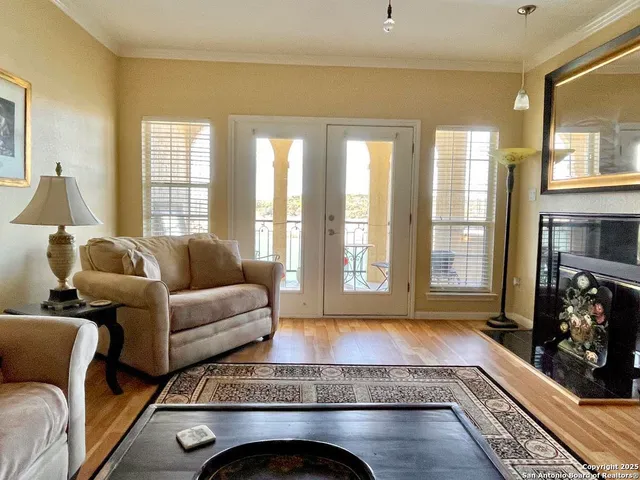 a living room with furniture and a fireplace