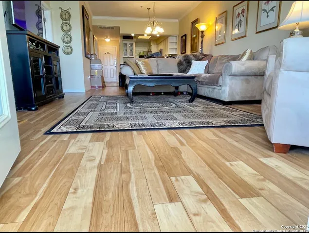 a living room with furniture and a rug