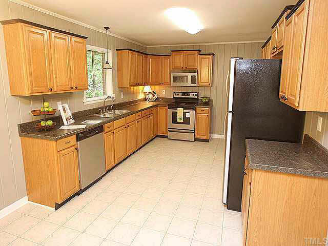 3318 Scott Drive Raleigh, NC 27604 - Photo 1 of 10 Absolutely Gorgeous kitchen!! All new stainless steel appliances and new tile floor. Custom cabinets and lots of space! The perfect kitchen for entertaining!