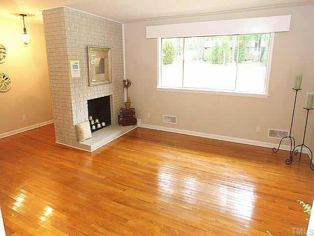 3318 Scott Drive Raleigh, NC 27604 - Photo 10 of 10 Beautiful Living room with masonary fireplace and beautiful hardwood floors! Transitional open floor plan for great entertaining!