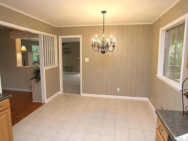 3318 Scott Drive Raleigh, NC 27604 - Photo 4 of 10 The dining room /kitchen area is tiled and is central to the living area of the house. It is the perfect size for those weekend dinner parties!