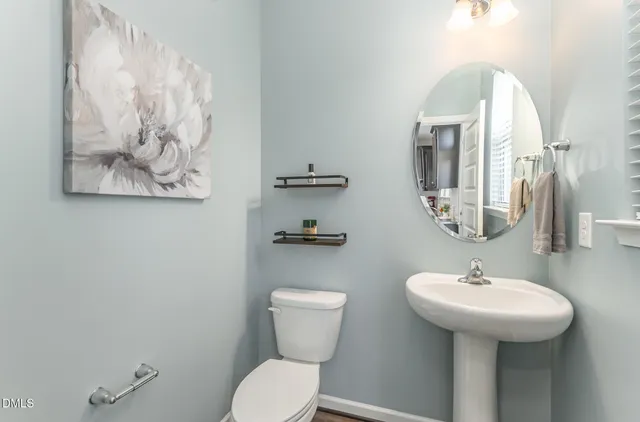 a living room with furniture kitchen view and a dining table