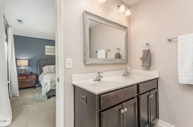 a view of walk in closet with clothes