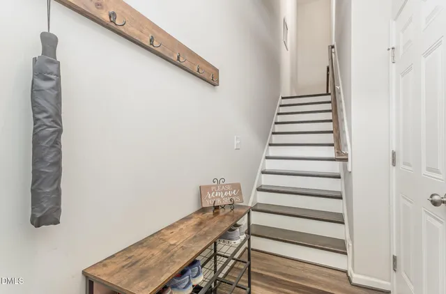 a view of a livingroom with furniture and a window