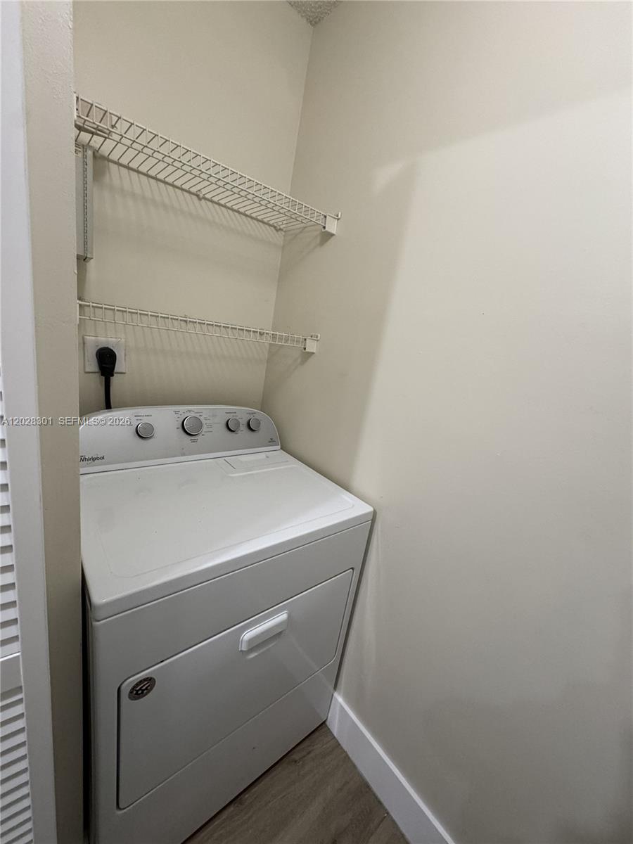 2021 Renaissance Boulevard, Unit 201 Miramar, FL 33025 - Photo 9 of 26 a utility room with dryer and washer