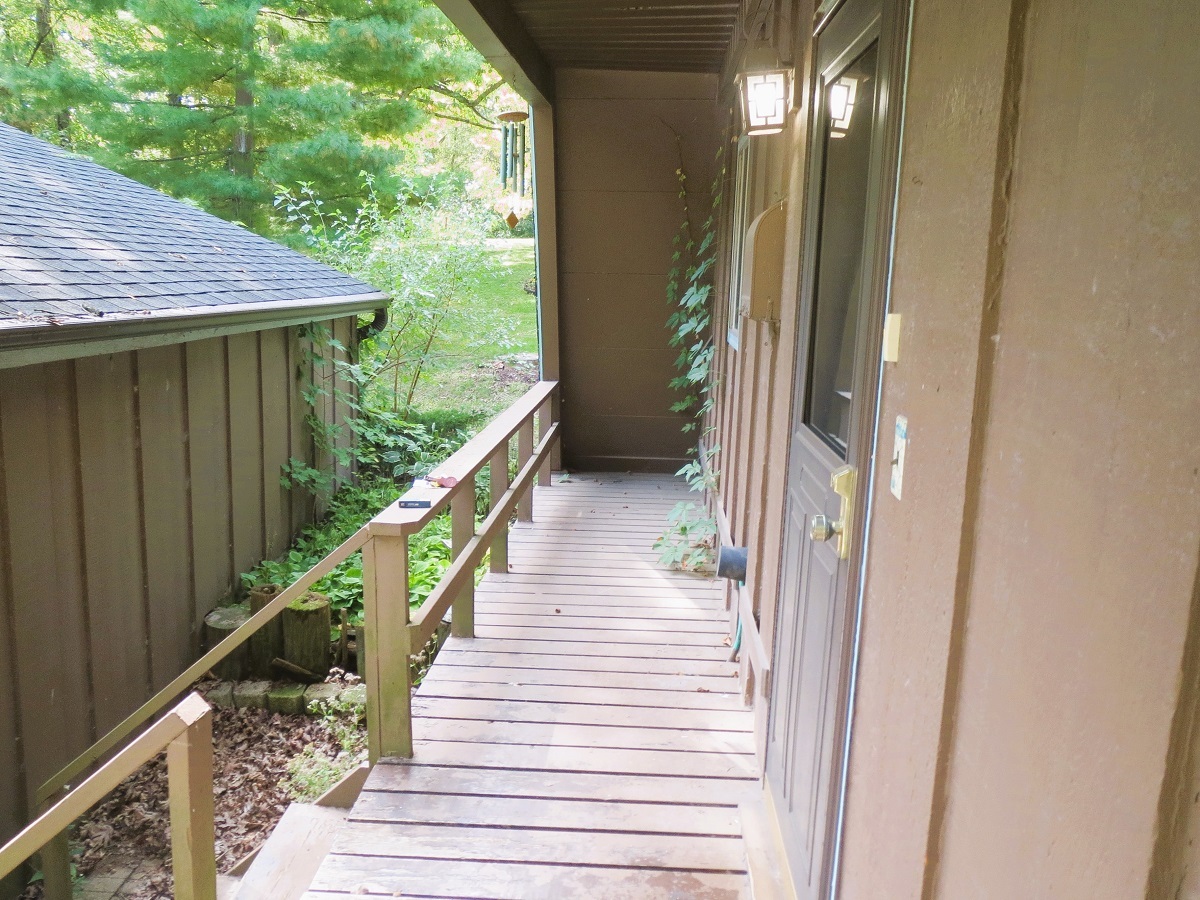 110 Hickory Lane Dixon, IL 61021 - Photo 19 of 24 a balcony with wooden floor and stairs