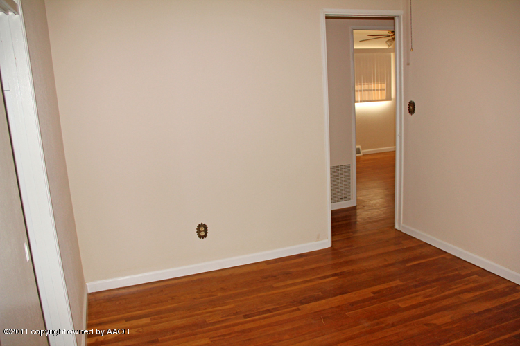 5127 Crockett Street Amarillo, TX 79110 - Photo 13 of 25 a view of a small space with wooden floor