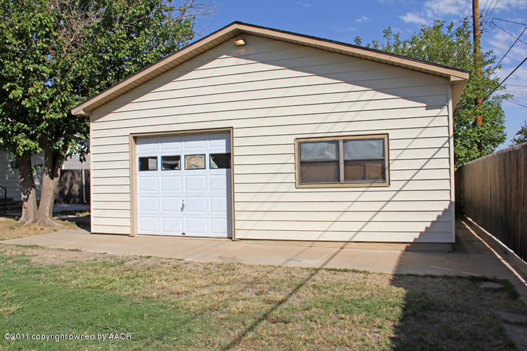 5127 Crockett Street Amarillo, TX 79110 - Photo 17 of 25 a view of a house with a yard