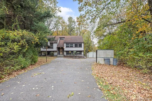 a view of entryway with wooden floor and stairs