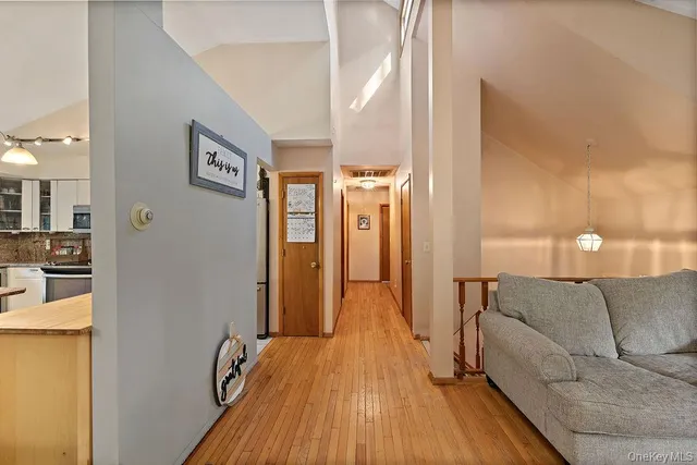 a view of a livingroom with furniture and a staircase