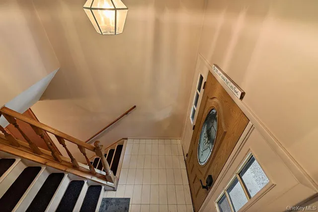 a living room with furniture a fireplace and a large window
