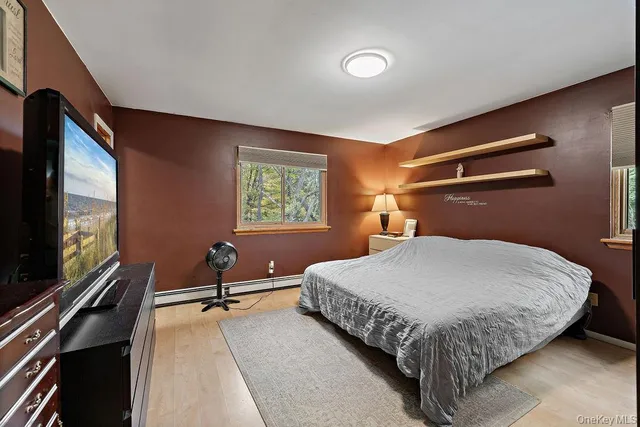 a bedroom with a bed and window