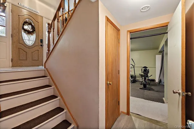 a view of a livingroom with furniture and a window