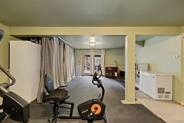 a view of a room with furniture and a window