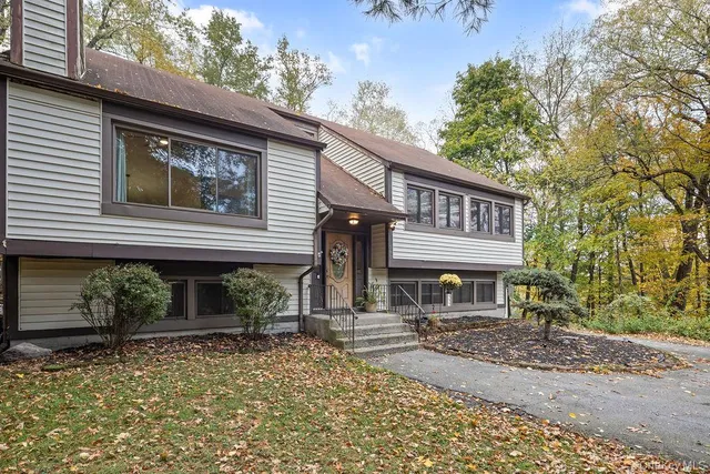 a view of backyard with sitting area