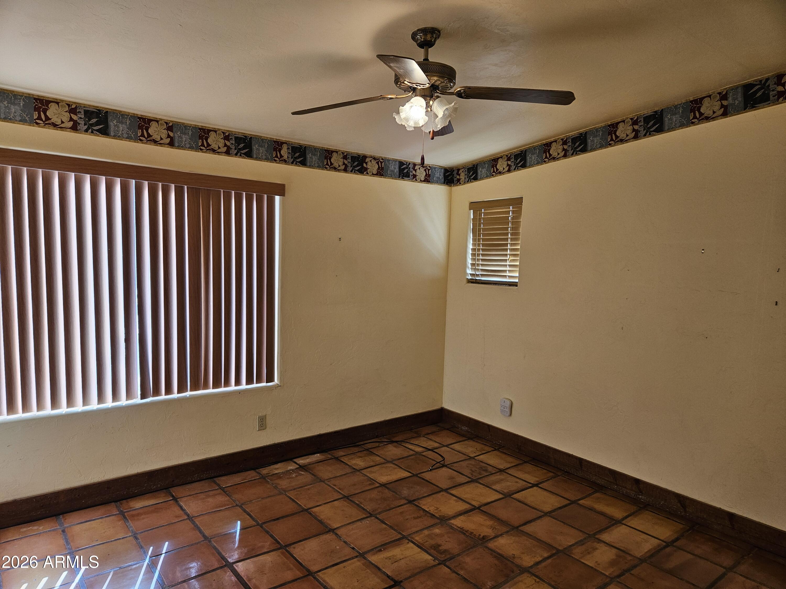 4105 North Washington Avenue Douglas, AZ 85607 - Photo 18 of 61 a view of a livingroom with a chandelier fan and a window
