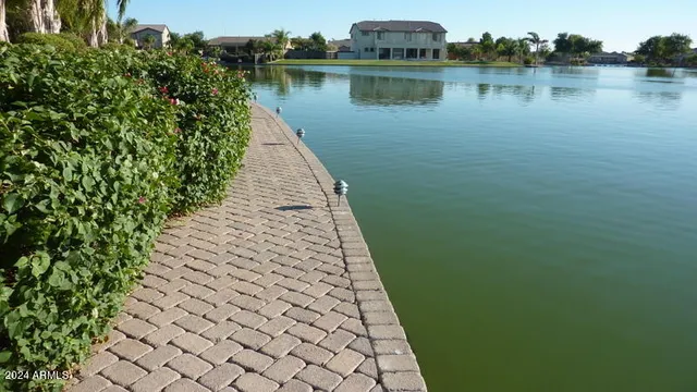 a view of a lake with a yard