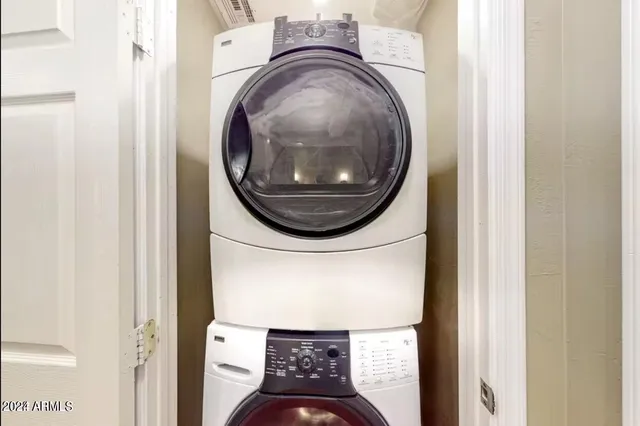 a view of a hallway with washer and dryer