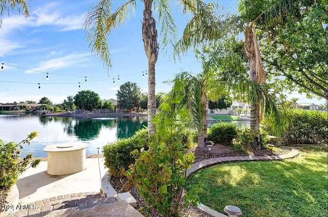a view of a lake with a house in the background