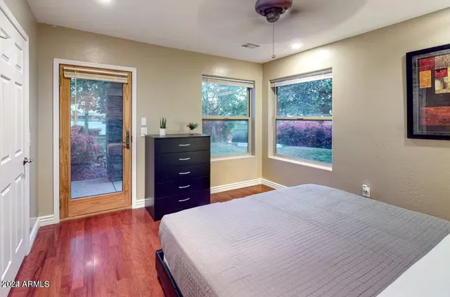 a bedroom with a bed and a dresser