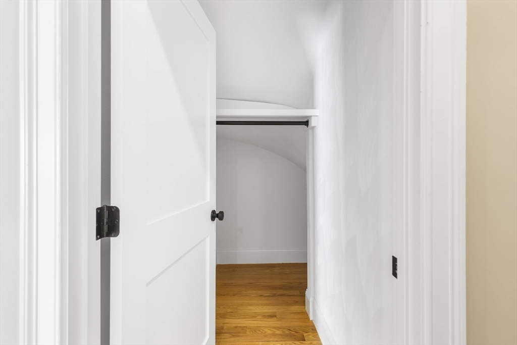 31 Woodale Avenue, Unit 1 Boston, MA 02126 - Photo 13 of 22 a view of a bathroom from a hallway