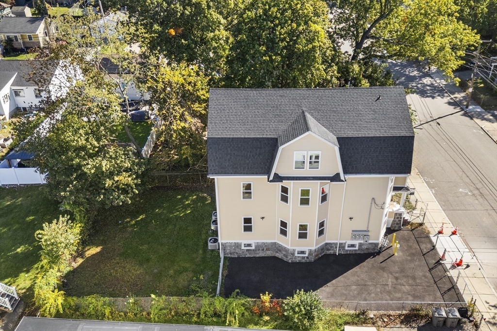 31 Woodale Avenue, Unit 1 Boston, MA 02126 - Photo 16 of 22 an aerial view of a house with a yard