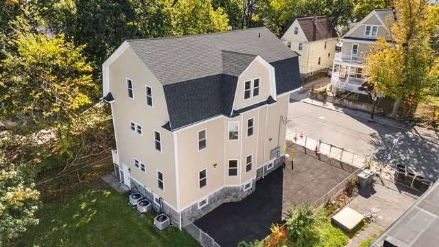aerial view of a house with wooden fence