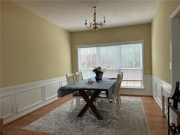 a view of a dining room with furniture and window