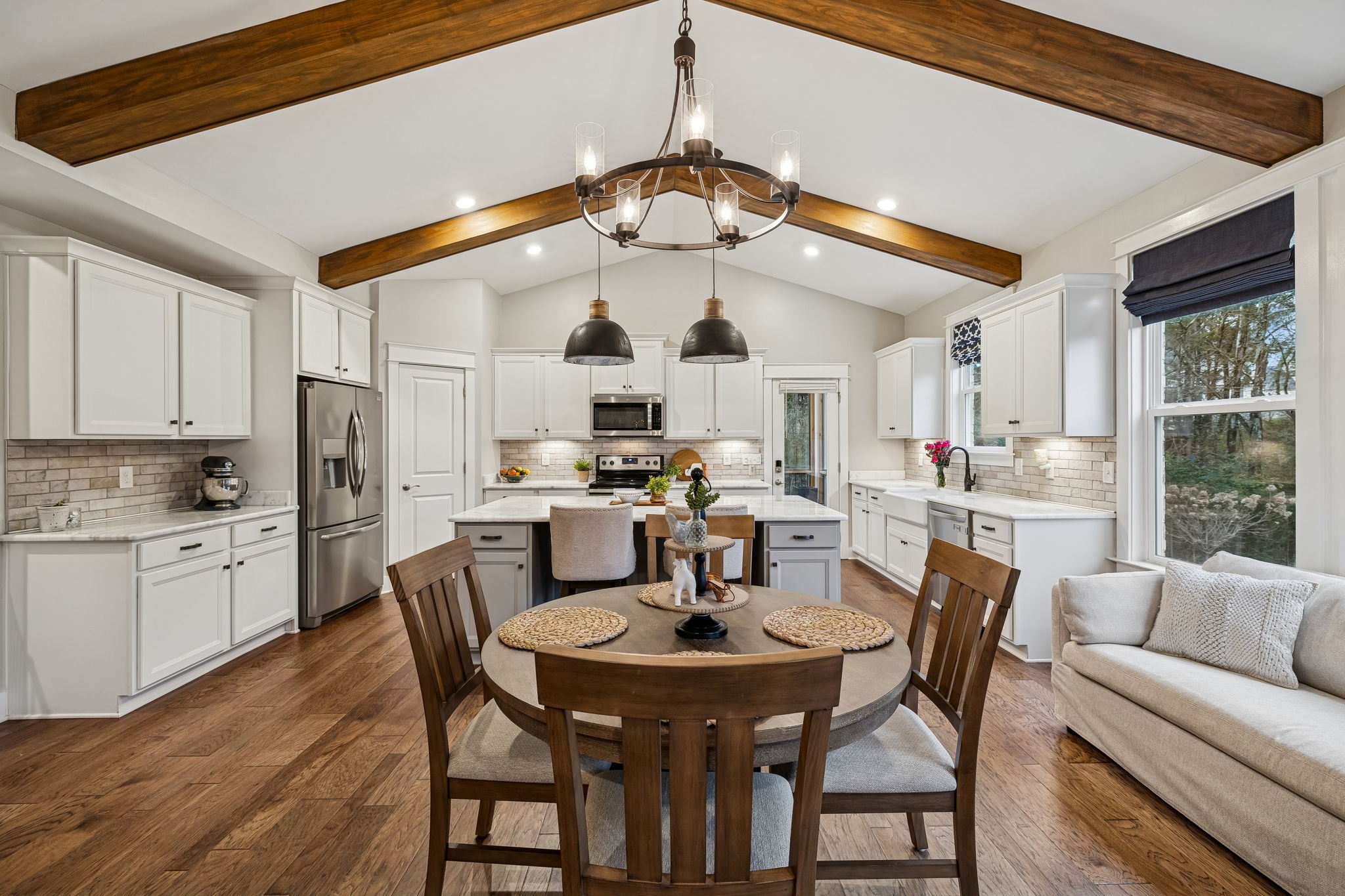 238 Caroline Way Mount Juliet, TN 37122 - Photo 14 of 51 a dining room with stainless steel appliances kitchen island granite countertop a dining table chairs and a oven
